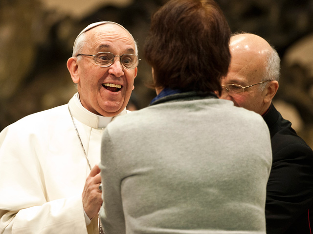 Pope-Francis-warmly-greets-a-woman-from-the-press-corps