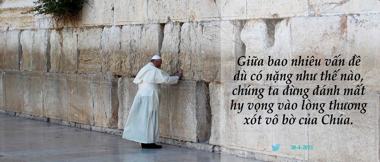 Pope Francis touches the stones of the Western Wall, Judaism's holiest prayer site, in Jerusalem's Old City