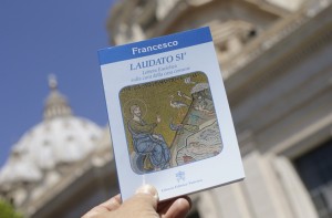 Pope Francis' new encyclical titled "Laudato Si (Be Praised), On the Care of Our Common Home", is displayed during the presentation news conference at the Vatican
