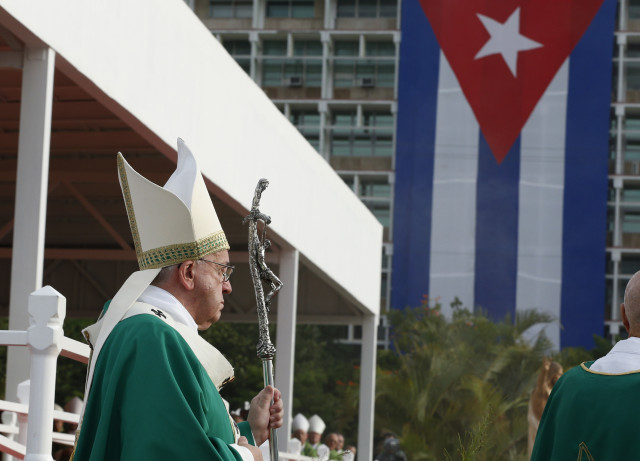 Cuba's flag seen as Pope Francis arrives to celebrate Mass in Revolution Square in Havana